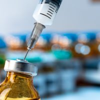 vaccine-bottle-with-a-syringe-taking-the-vaccine-from-it